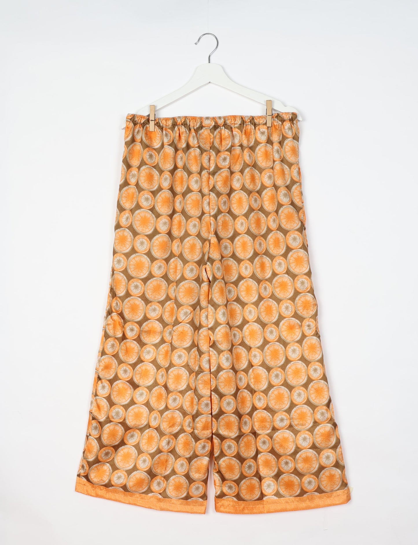 Step into sustainable fashion with our Palazzo Pants – a harmonious blend of Indian and Italian influences. These wide-legged pants, made from upcycled saris, offer comfort with an all-around elastic waist and a stylish flared leg. Make a statement with eco-friendly, chic palazzo pants that redefine ethical clothing.