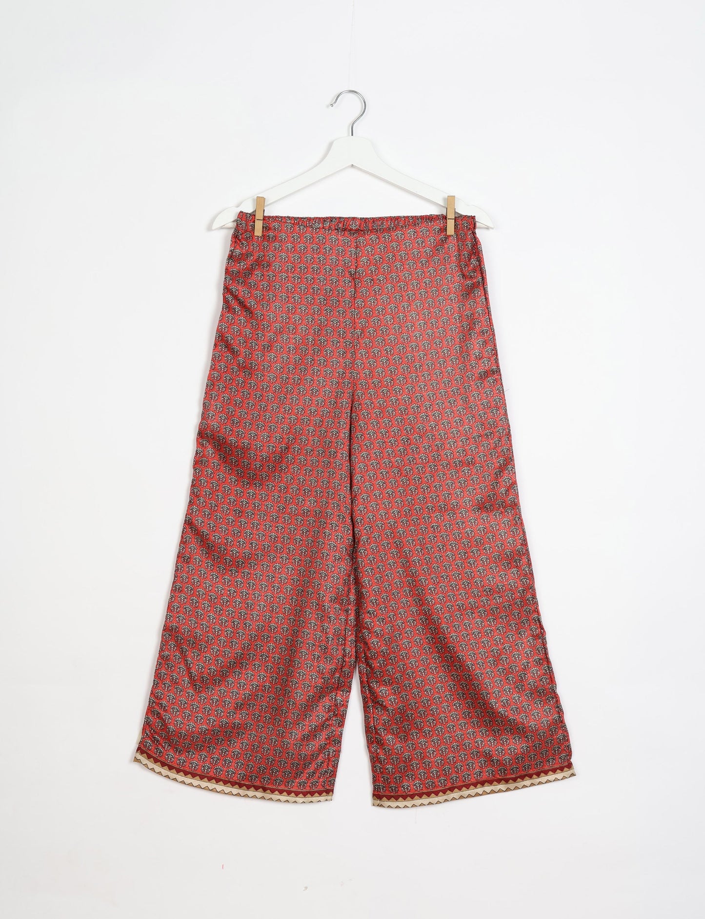 Step into sustainable fashion with our Palazzo Pants – a harmonious blend of Indian and Italian influences. These wide-legged pants, made from upcycled saris, offer comfort with an all-around elastic waist and a stylish flared leg. Make a statement with eco-friendly, chic palazzo pants that redefine ethical clothing.