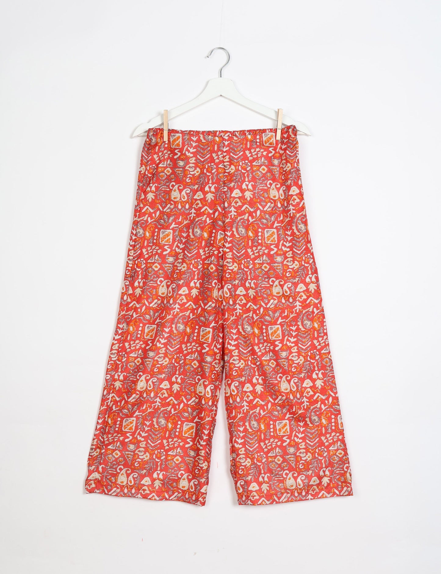 Step into sustainable fashion with our Palazzo Pants – a harmonious blend of Indian and Italian influences. These wide-legged pants, made from upcycled saris, offer comfort with an all-around elastic waist and a stylish flared leg. Make a statement with eco-friendly, chic palazzo pants that redefine ethical clothing.