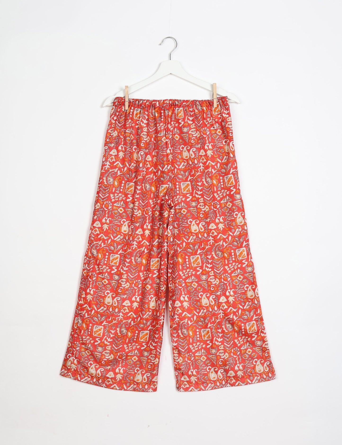 Step into sustainable fashion with our Palazzo Pants – a harmonious blend of Indian and Italian influences. These wide-legged pants, made from upcycled saris, offer comfort with an all-around elastic waist and a stylish flared leg. Make a statement with eco-friendly, chic palazzo pants that redefine ethical clothing.