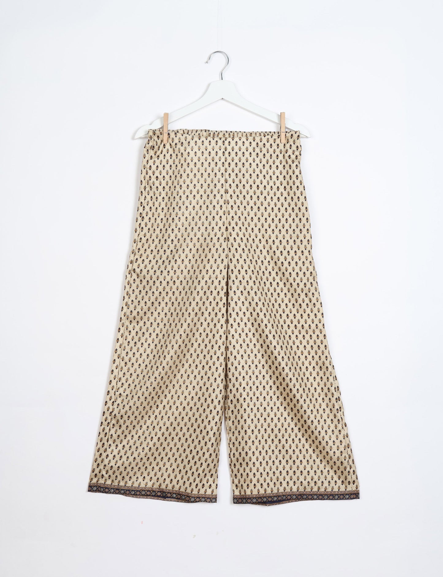 Step into sustainable fashion with our Palazzo Pants – a harmonious blend of Indian and Italian influences. These wide-legged pants, made from upcycled saris, offer comfort with an all-around elastic waist and a stylish flared leg. Make a statement with eco-friendly, chic palazzo pants that redefine ethical clothing.