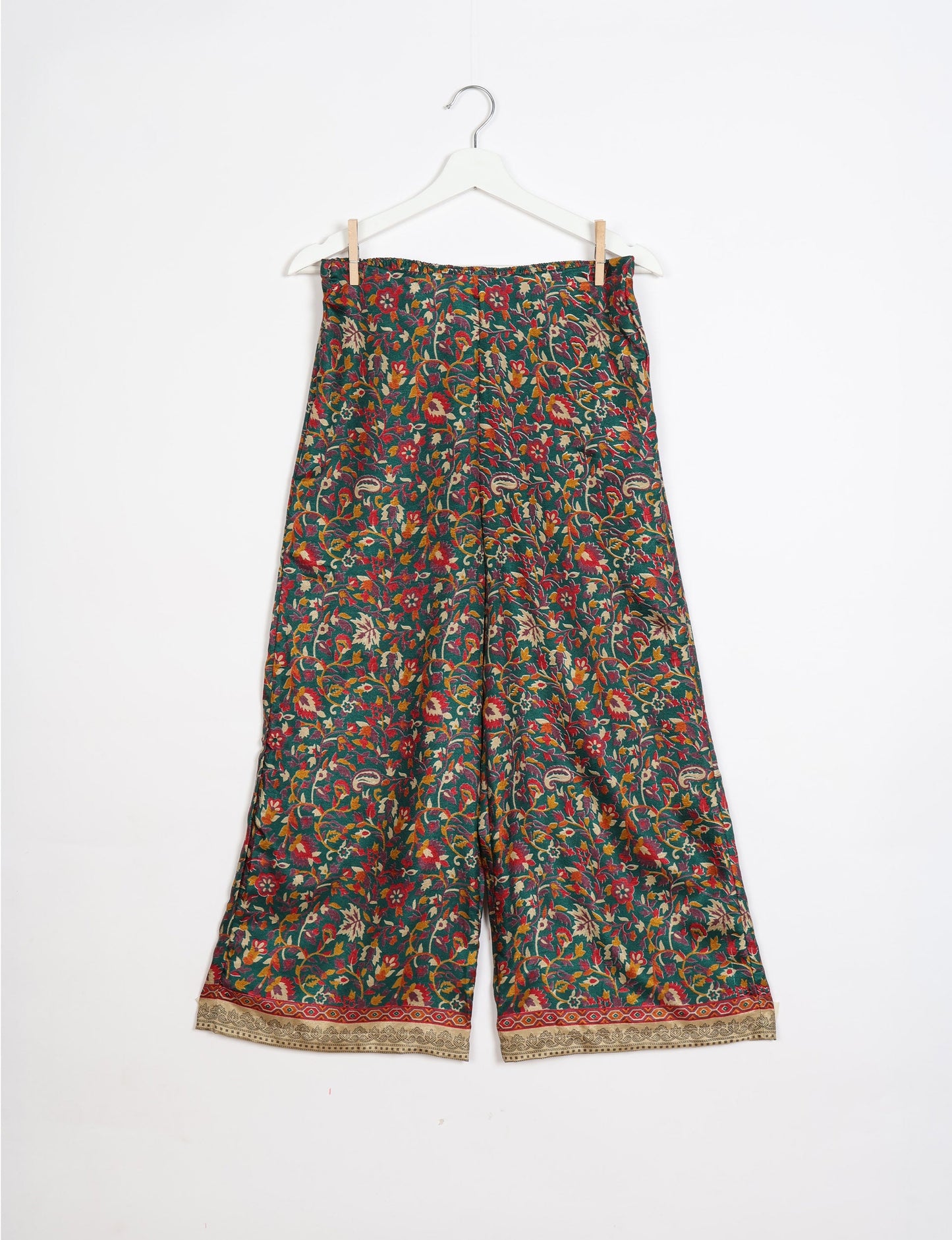 Step into sustainable fashion with our Palazzo Pants – a harmonious blend of Indian and Italian influences. These wide-legged pants, made from upcycled saris, offer comfort with an all-around elastic waist and a stylish flared leg. Make a statement with eco-friendly, chic palazzo pants that redefine ethical clothing.