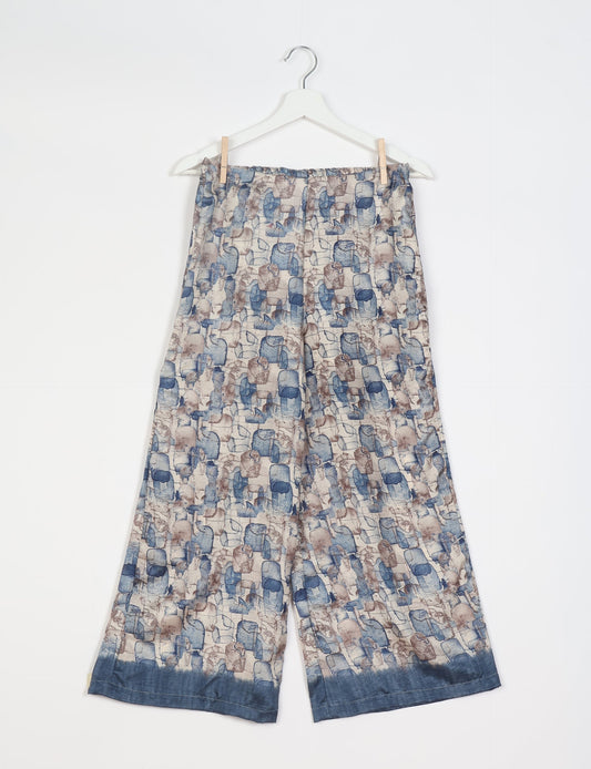 Step into sustainable fashion with our Palazzo Pants – a harmonious blend of Indian and Italian influences. These wide-legged pants, made from upcycled saris, offer comfort with an all-around elastic waist and a stylish flared leg. Make a statement with eco-friendly, chic palazzo pants that redefine ethical clothing.