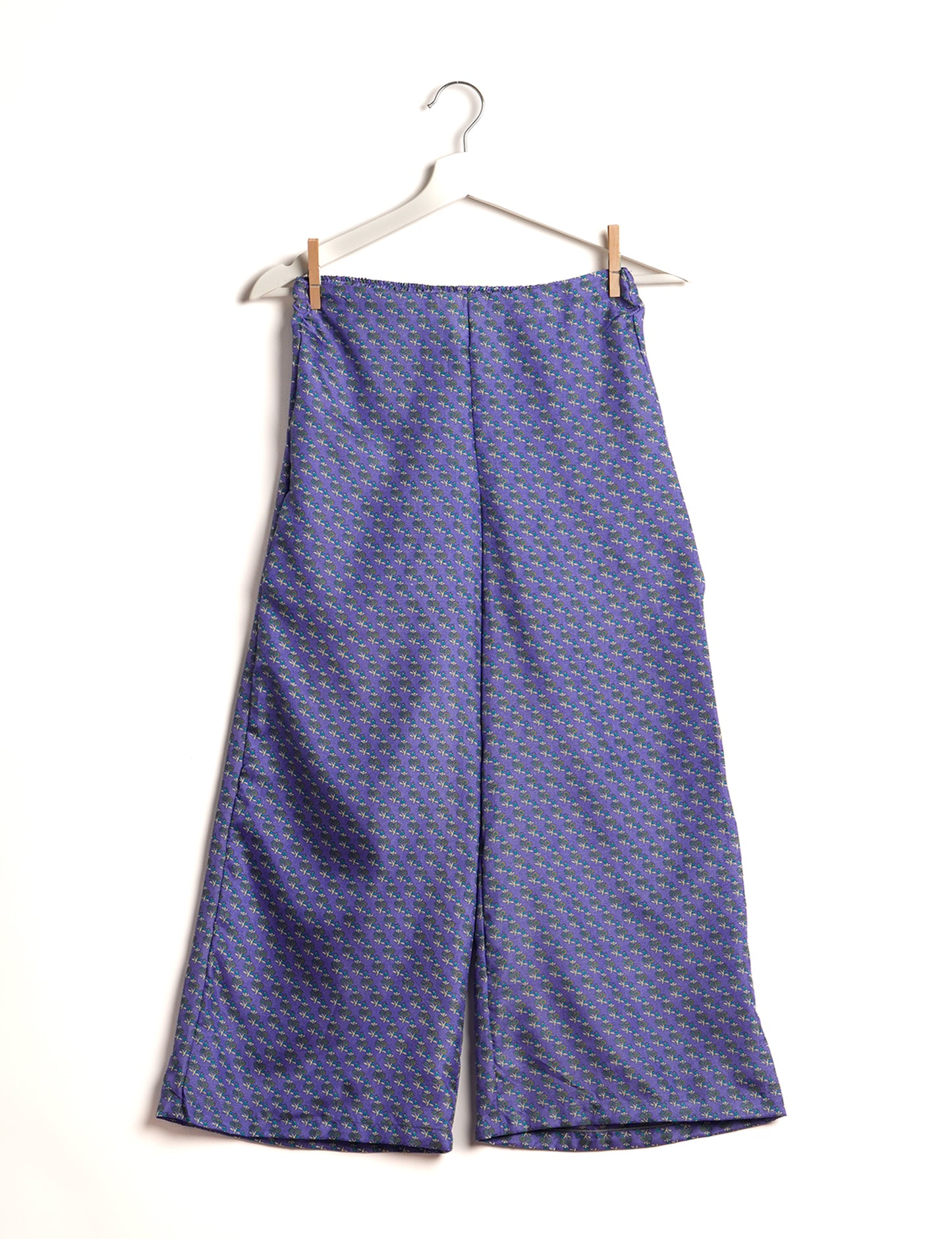 Step into sustainable fashion with our Palazzo Pants – a harmonious blend of Indian and Italian influences. These wide-legged pants, made from upcycled saris, offer comfort with an all-around elastic waist and a stylish flared leg. Make a statement with eco-friendly, chic palazzo pants that redefine ethical clothing.