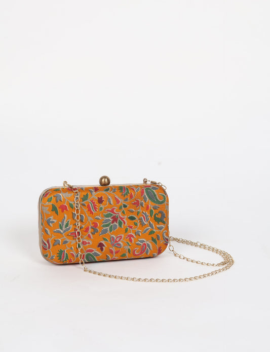 Stylish CLUTCH HANDBAG, a perfect companion for your evening look. Firm rectangular frame, optional metallic sling, and stunning prints add color to your outfit. Eco-friendly and ethically crafted for sustainable fashion.