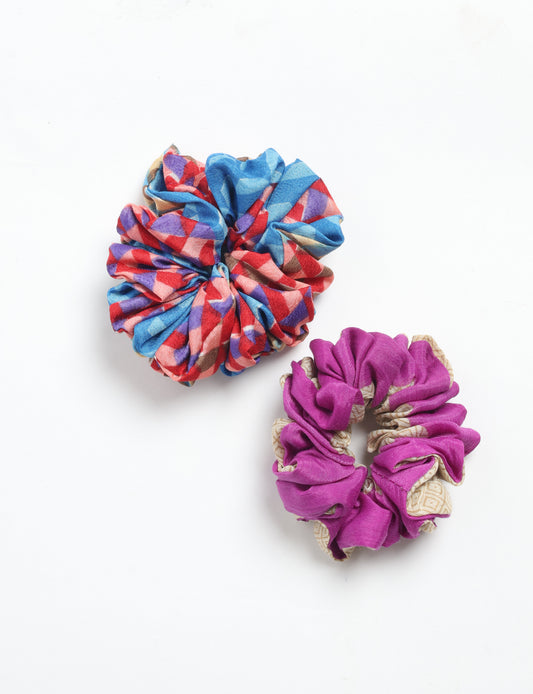 Upgrade your hairstyle with our Scrunchy Set of 2 – elastic hair ties wrapped in colorful Indian sari fabric. A top pick in ethical and green fashion, these eco-friendly prints add flair to your wrist and hair, making a sustainable style statement that catches attention and sparks change.