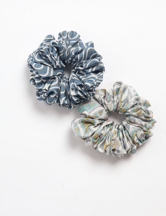 Upgrade your hairstyle with our Scrunchy Set of 2 – elastic hair ties wrapped in colorful Indian sari fabric. A top pick in ethical and green fashion, these eco-friendly prints add flair to your wrist and hair, making a sustainable style statement that catches attention and sparks change.
