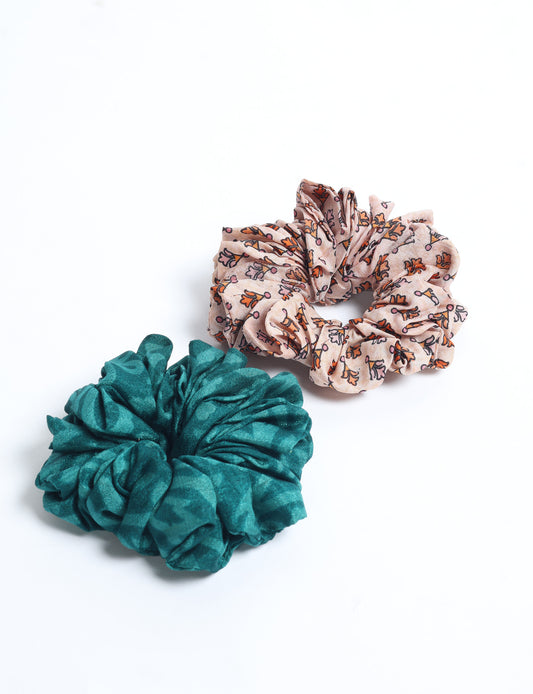 Upgrade your hairstyle with our Scrunchy Set of 2 – elastic hair ties wrapped in colorful Indian sari fabric. A top pick in ethical and green fashion, these eco-friendly prints add flair to your wrist and hair, making a sustainable style statement that catches attention and sparks change.