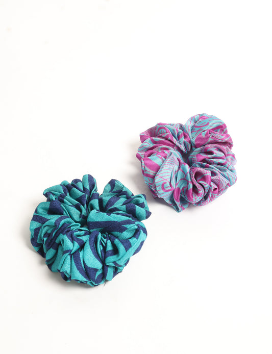 Upgrade your hairstyle with our Scrunchy Set of 2 – elastic hair ties wrapped in colorful Indian sari fabric. A top pick in ethical and green fashion, these eco-friendly prints add flair to your wrist and hair, making a sustainable style statement that catches attention and sparks change.