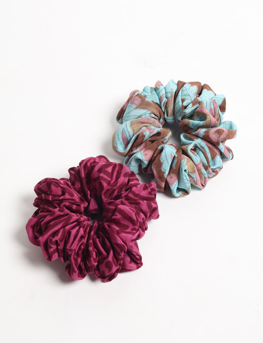 Upgrade your hairstyle with our Scrunchy Set of 2 – elastic hair ties wrapped in colorful Indian sari fabric. A top pick in ethical and green fashion, these eco-friendly prints add flair to your wrist and hair, making a sustainable style statement that catches attention and sparks change.