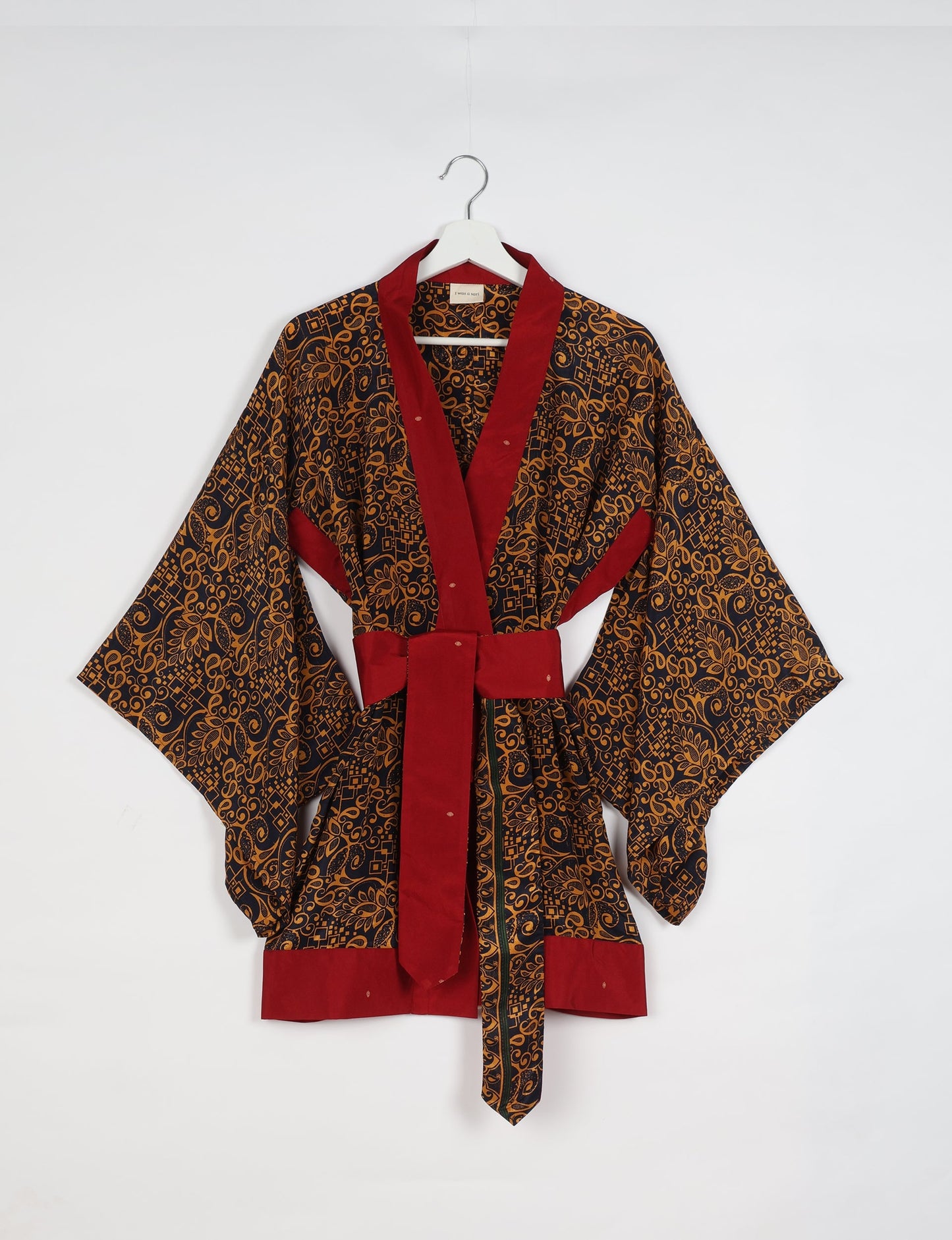 Radiant and sustainably crafted KIMONO with humble beginnings from the streets of India. Versatile and eco-friendly layering piece for casual trousers, swimwear, or our spaghetti strap dress. Embrace conscious fashion and sustainable style with this unique and culturally inspired kimono, sure to invite compliments.