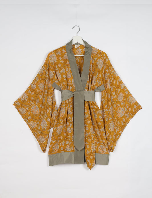 Radiant and sustainably crafted KIMONO with humble beginnings from the streets of India. Versatile and eco-friendly layering piece for casual trousers, swimwear, or our spaghetti strap dress. Embrace conscious fashion and sustainable style with this unique and culturally inspired kimono, sure to invite compliments.
