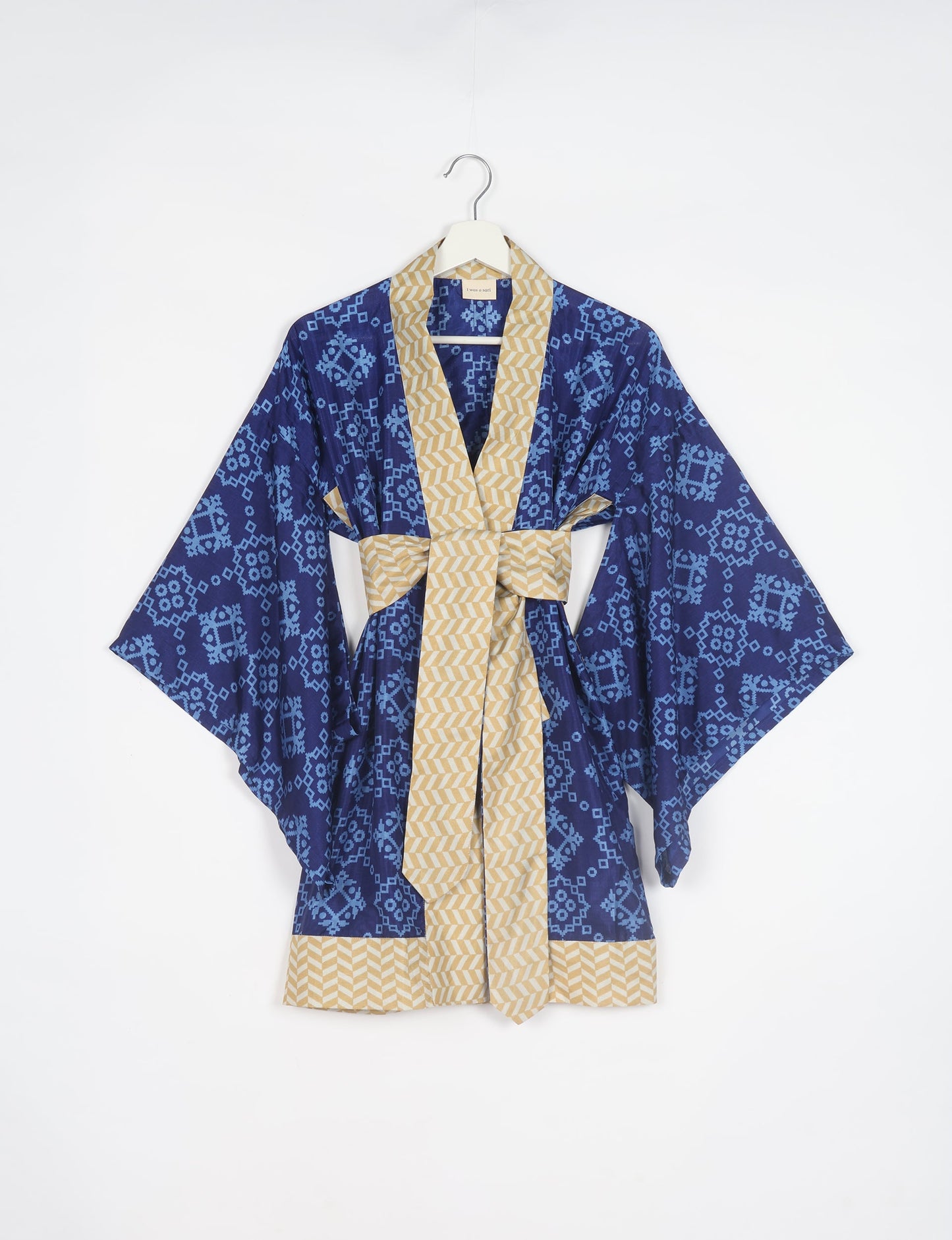 Radiant and sustainably crafted KIMONO with humble beginnings from the streets of India. Versatile and eco-friendly layering piece for casual trousers, swimwear, or our spaghetti strap dress. Embrace conscious fashion and sustainable style with this unique and culturally inspired kimono, sure to invite compliments.