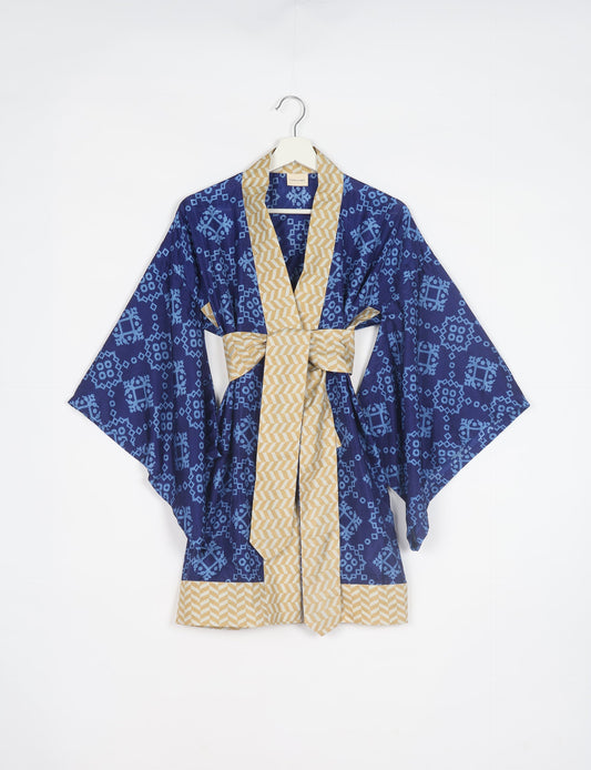 Radiant and sustainably crafted KIMONO with humble beginnings from the streets of India. Versatile and eco-friendly layering piece for casual trousers, swimwear, or our spaghetti strap dress. Embrace conscious fashion and sustainable style with this unique and culturally inspired kimono, sure to invite compliments.