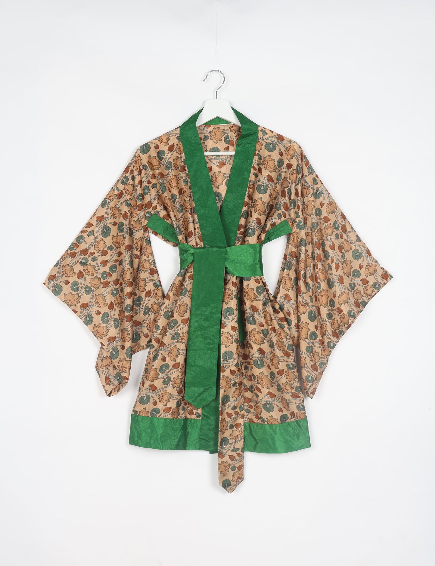 Radiant and sustainably crafted KIMONO with humble beginnings from the streets of India. Versatile and eco-friendly layering piece for casual trousers, swimwear, or our spaghetti strap dress. Embrace conscious fashion and sustainable style with this unique and culturally inspired kimono, sure to invite compliments.