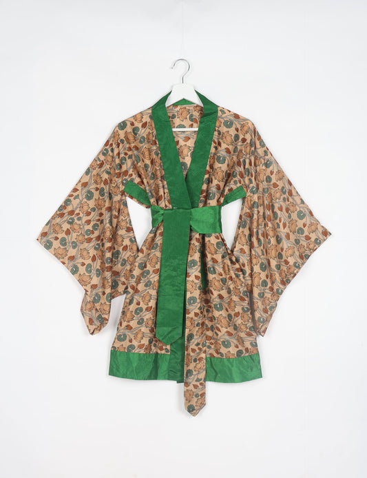 Radiant and sustainably crafted KIMONO with humble beginnings from the streets of India. Versatile and eco-friendly layering piece for casual trousers, swimwear, or our spaghetti strap dress. Embrace conscious fashion and sustainable style with this unique and culturally inspired kimono, sure to invite compliments.