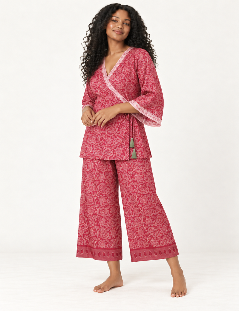 Pink tunic set with micro leaf pattern, turquoise trim on neckline and sleeves, and matching wide-leg pants with border print