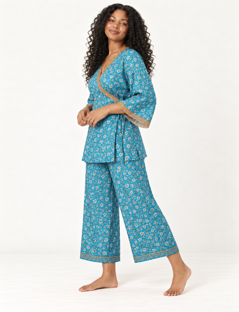 Pink tunic set with micro leaf pattern, turquoise trim on neckline and sleeves, and matching wide-leg pants with border print