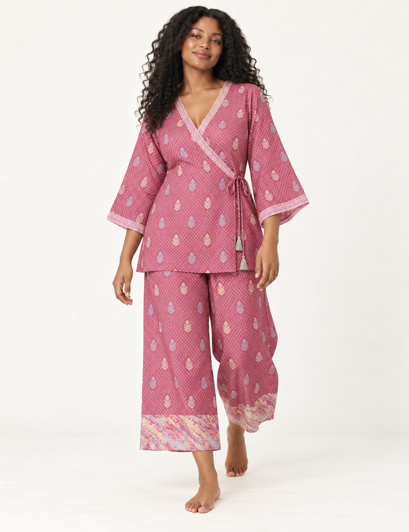 Pink tunic set with micro leaf pattern, turquoise trim on neckline and sleeves, and matching wide-leg pants with border print