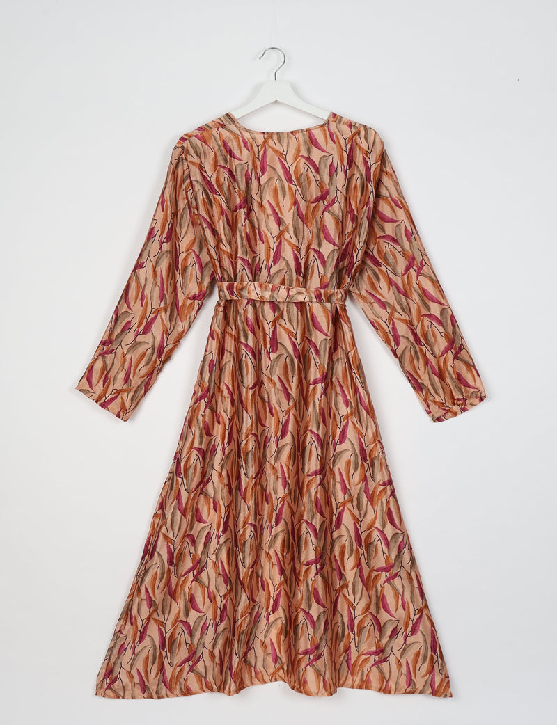 Beige beach robe with long sleeves and belt, featuring a multicolor leaf pattern in orange, pink, and brown, shown flat on