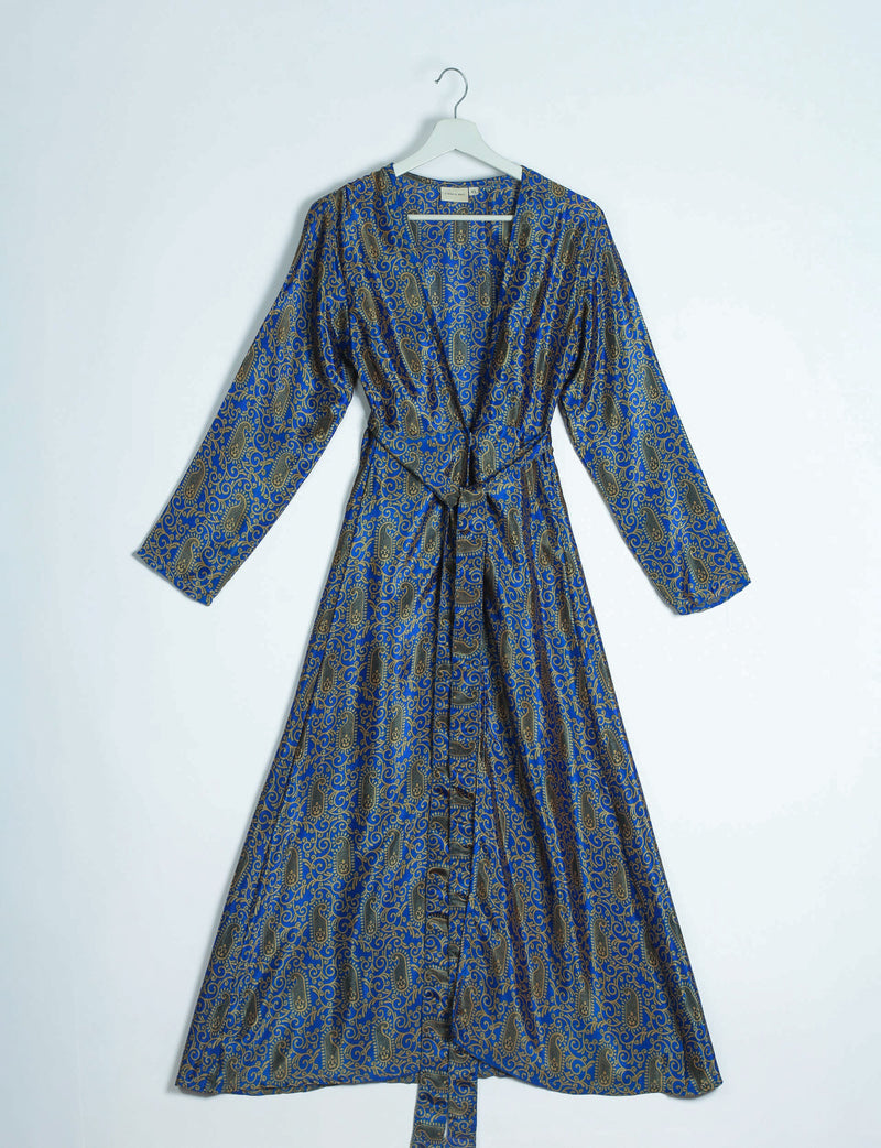 Blue and gold paisley patterned long sleeve robe with belt, hanging on white hanger against white background