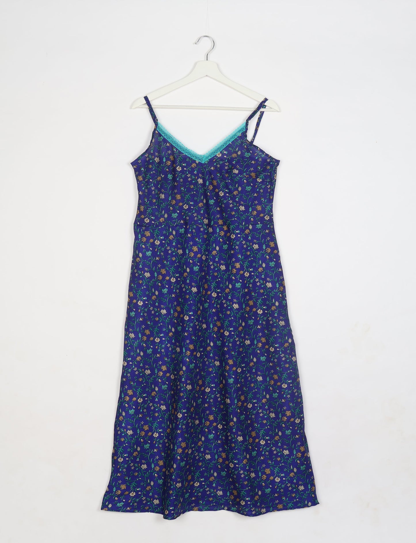 Spaghetti strap dress made from sustainable materials, embodying ethical fashion principles. Ideal for eco-friendly travelers seeking laid-back style.