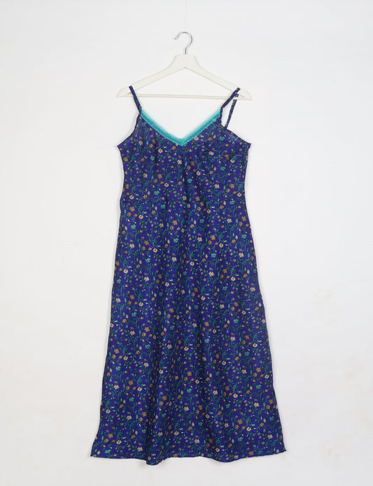 Spaghetti strap dress made from sustainable materials, embodying ethical fashion principles. Ideal for eco-friendly travelers seeking laid-back style.