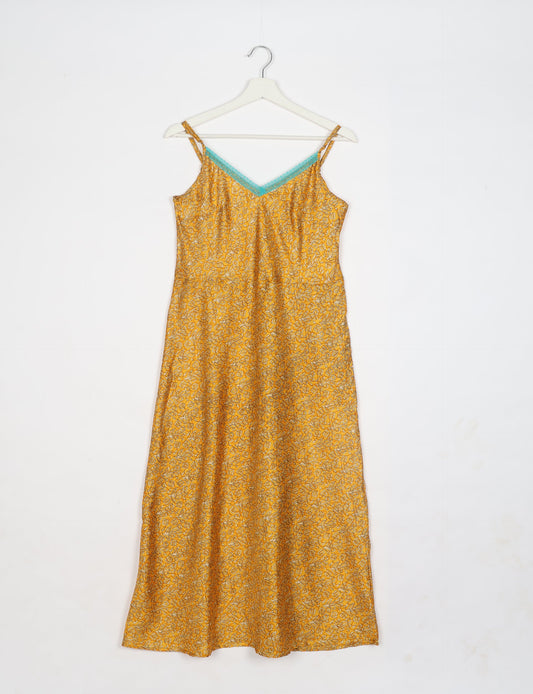 Spaghetti strap dress made from sustainable materials, embodying ethical fashion principles. Ideal for eco-friendly travelers seeking laid-back style.