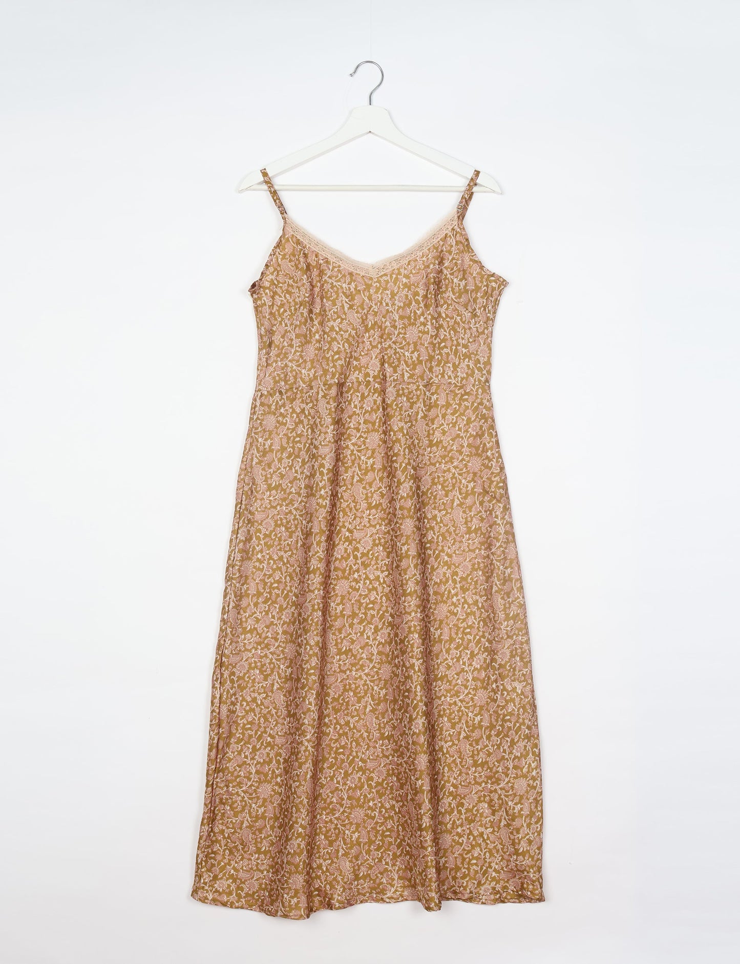 Spaghetti strap dress made from sustainable materials, embodying ethical fashion principles. Ideal for eco-friendly travelers seeking laid-back style.