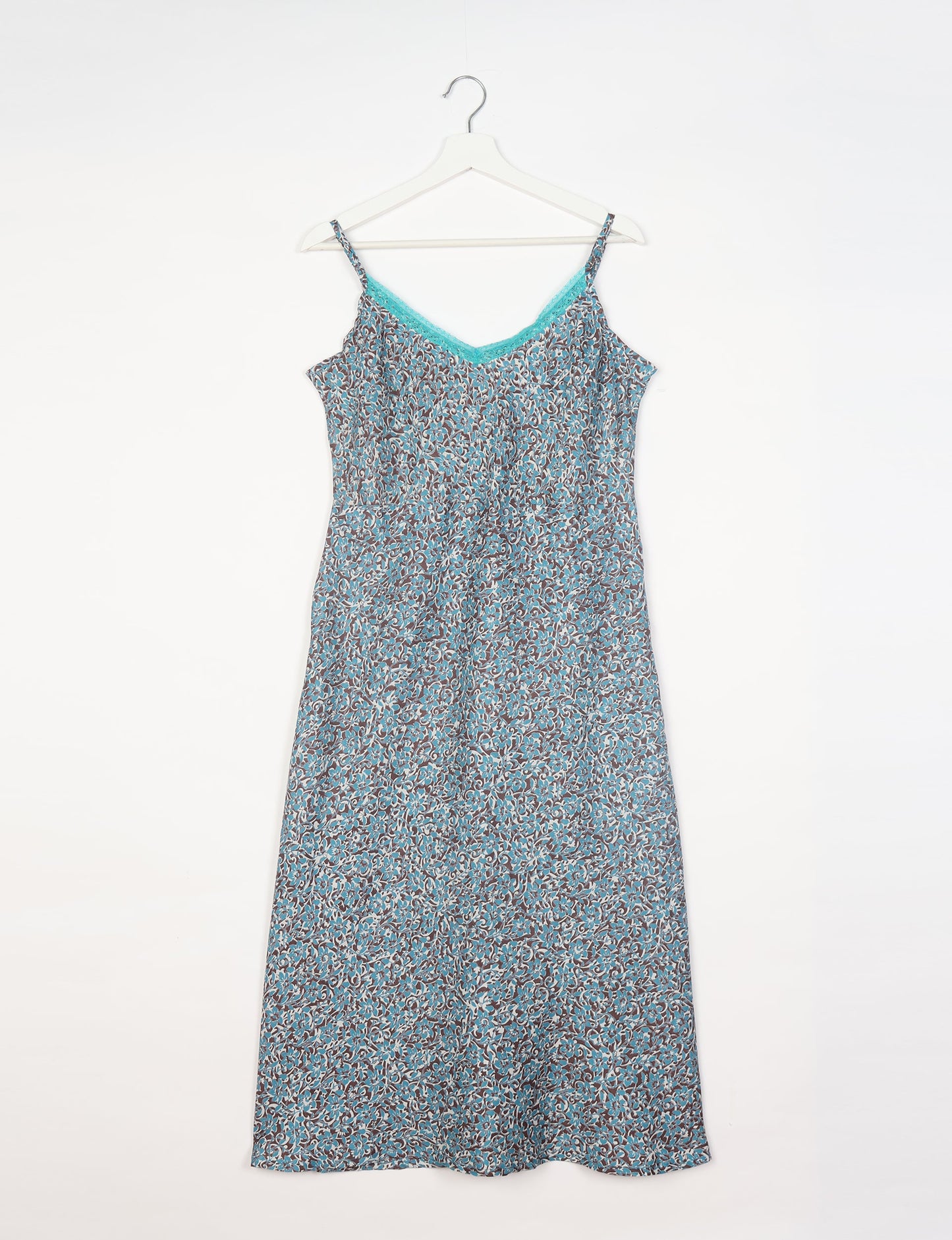 Spaghetti strap dress made from sustainable materials, embodying ethical fashion principles. Ideal for eco-friendly travelers seeking laid-back style.