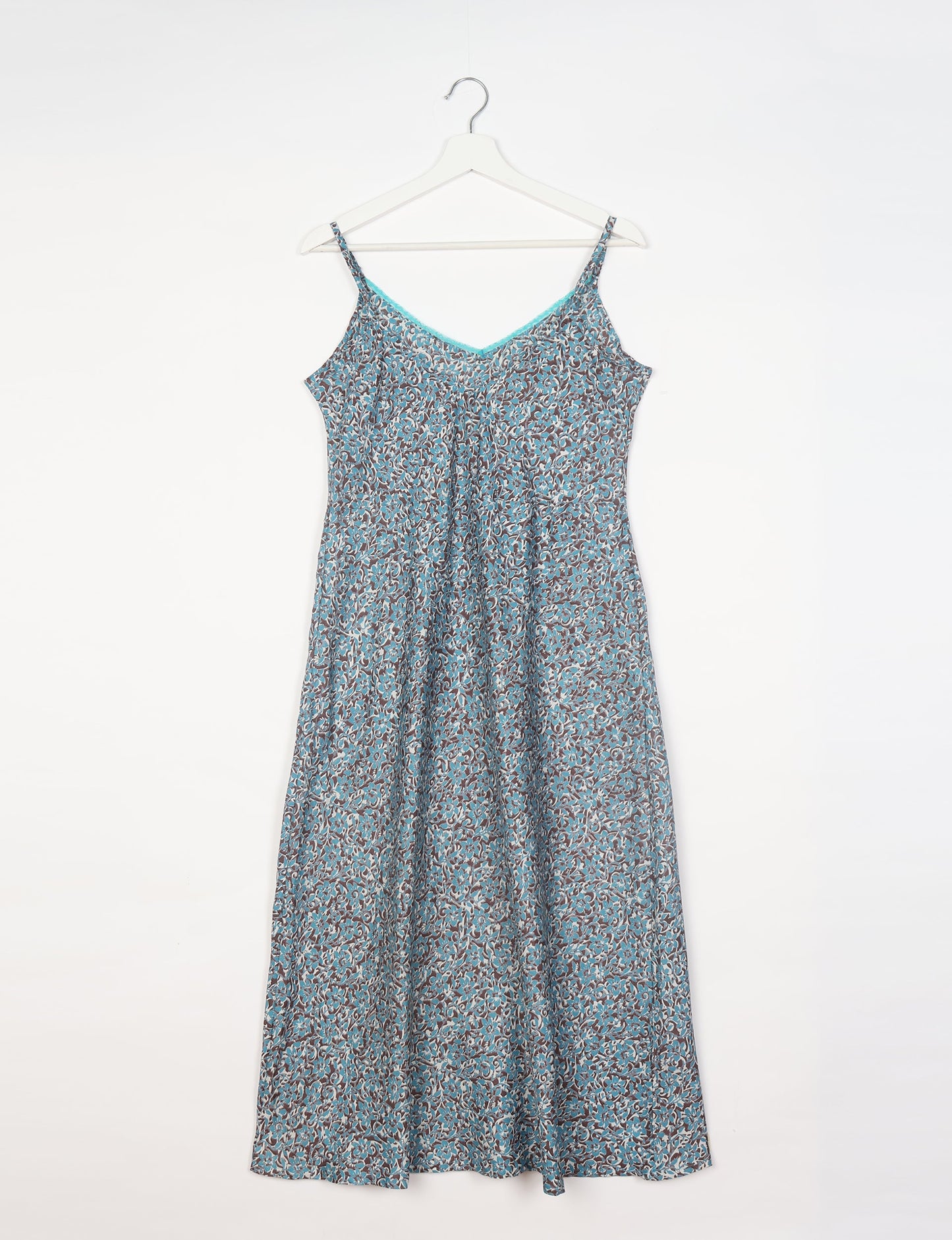 Spaghetti strap dress made from sustainable materials, embodying ethical fashion principles. Ideal for eco-friendly travelers seeking laid-back style.