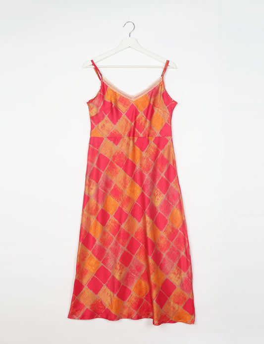 Spaghetti strap dress made from sustainable materials, embodying ethical fashion principles. Ideal for eco-friendly travelers seeking laid-back style.