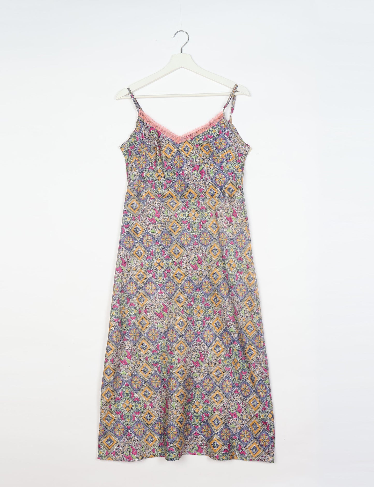 Spaghetti strap dress made from sustainable materials, embodying ethical fashion principles. Ideal for eco-friendly travelers seeking laid-back style.