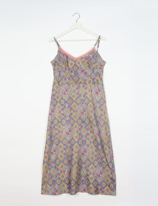 Spaghetti strap dress made from sustainable materials, embodying ethical fashion principles. Ideal for eco-friendly travelers seeking laid-back style.