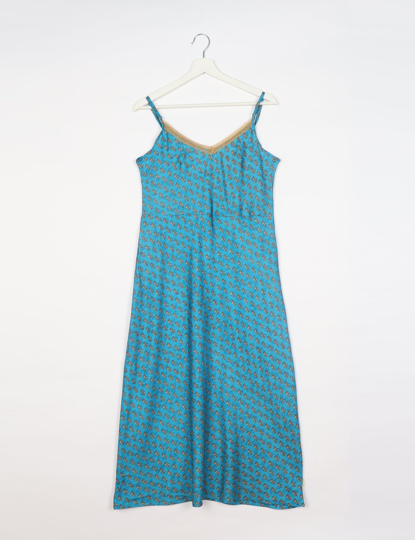 Spaghetti strap dress made from sustainable materials, embodying ethical fashion principles. Ideal for eco-friendly travelers seeking laid-back style.