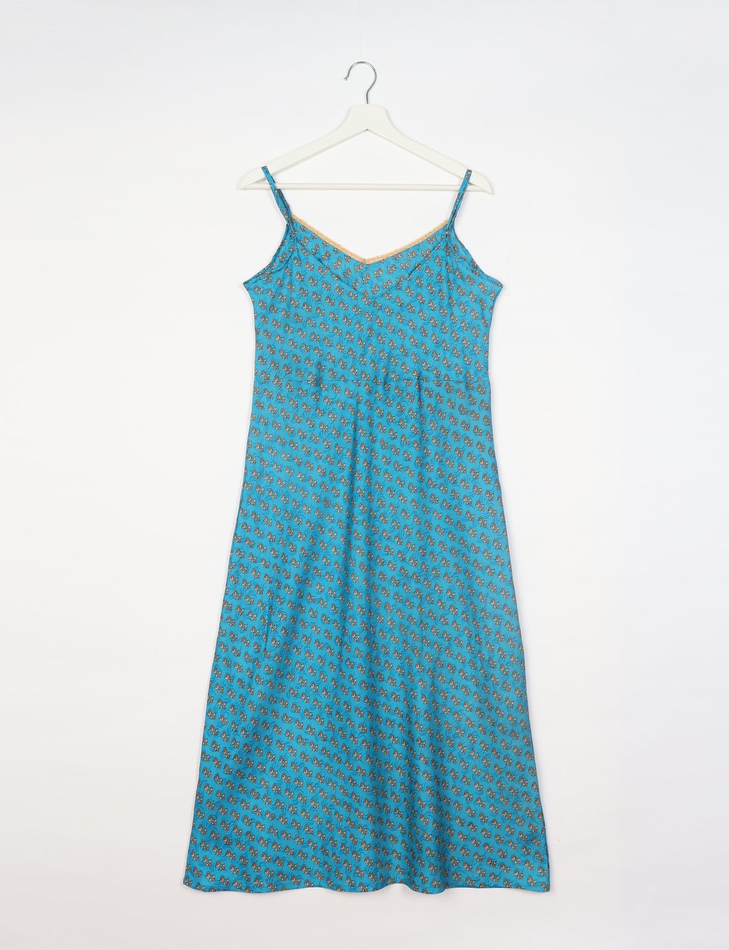 Spaghetti strap dress made from sustainable materials, embodying ethical fashion principles. Ideal for eco-friendly travelers seeking laid-back style.