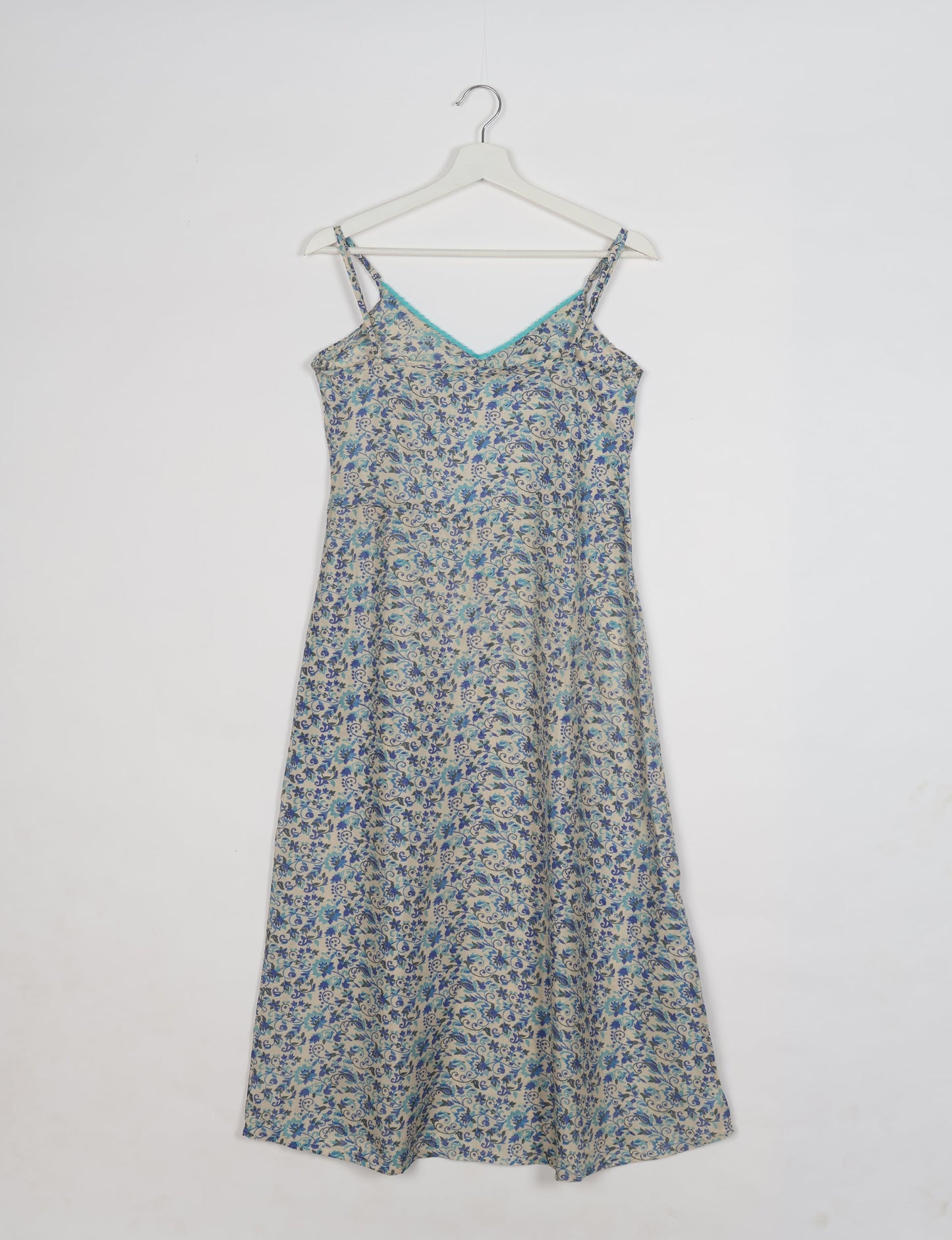 Spaghetti strap dress made from sustainable materials, embodying ethical fashion principles. Ideal for eco-friendly travelers seeking laid-back style.