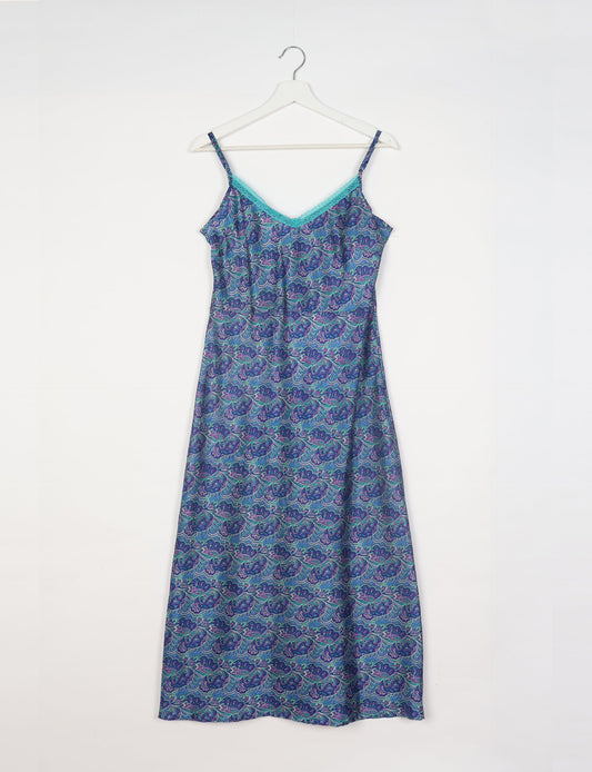 Spaghetti strap dress made from sustainable materials, embodying ethical fashion principles. Ideal for eco-friendly travelers seeking laid-back style.