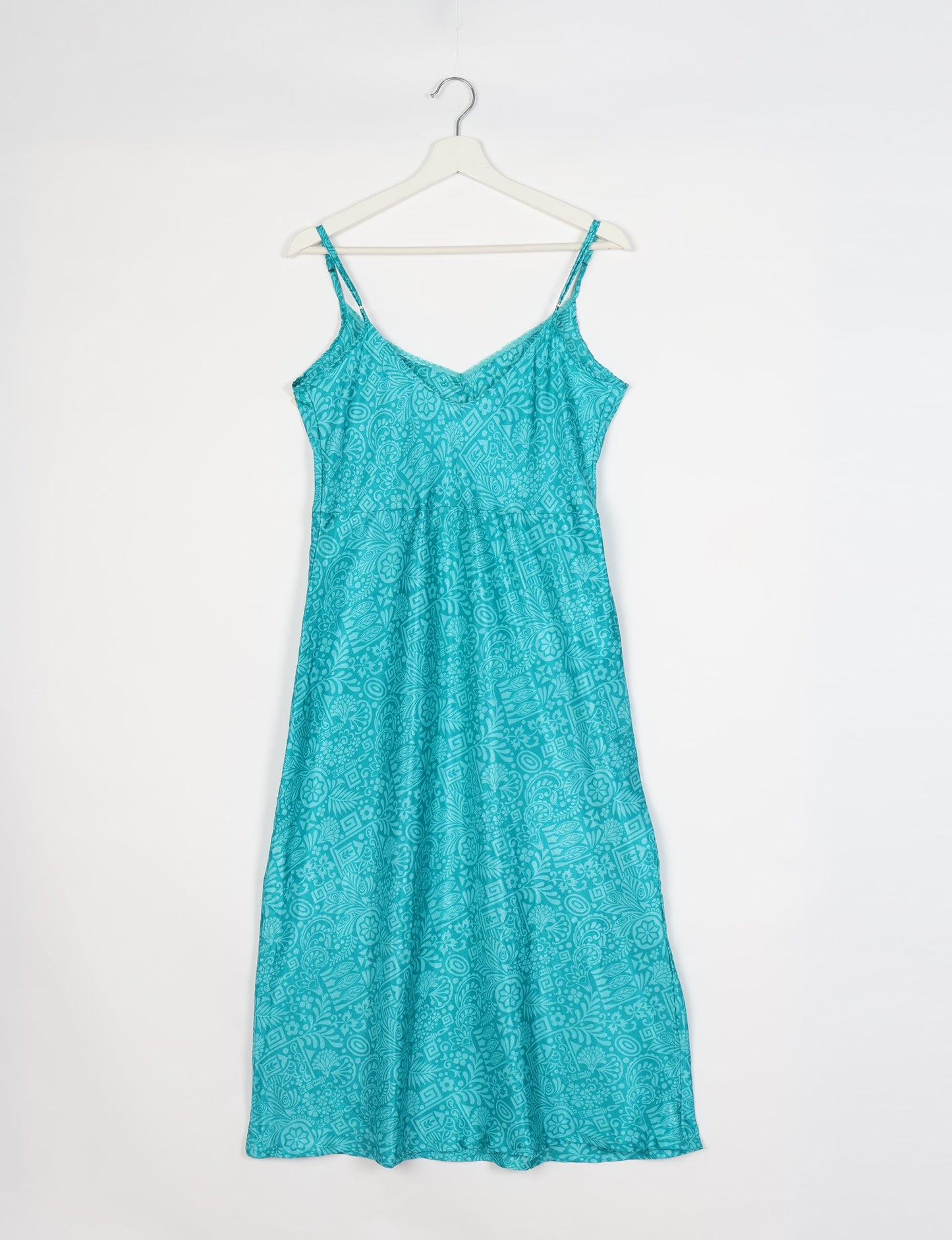 Spaghetti strap dress made from sustainable materials, embodying ethical fashion principles. Ideal for eco-friendly travelers seeking laid-back style.