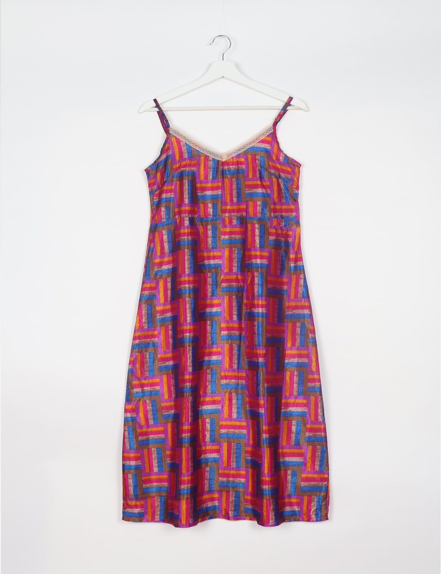 Spaghetti strap dress made from sustainable materials, embodying ethical fashion principles. Ideal for eco-friendly travelers seeking laid-back style.