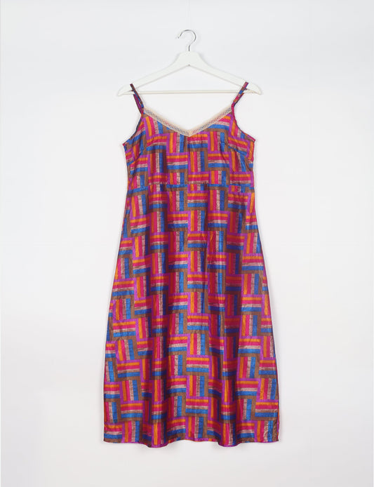 Spaghetti strap dress made from sustainable materials, embodying ethical fashion principles. Ideal for eco-friendly travelers seeking laid-back style.