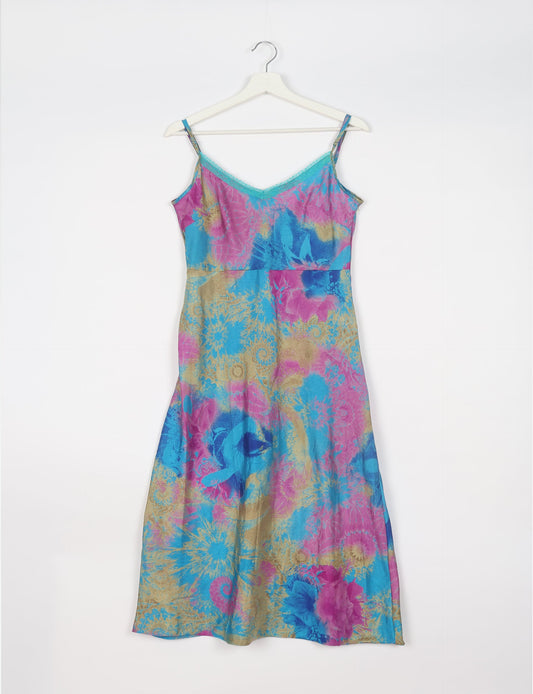 Spaghetti strap dress made from sustainable materials, embodying ethical fashion principles. Ideal for eco-friendly travelers seeking laid-back style.