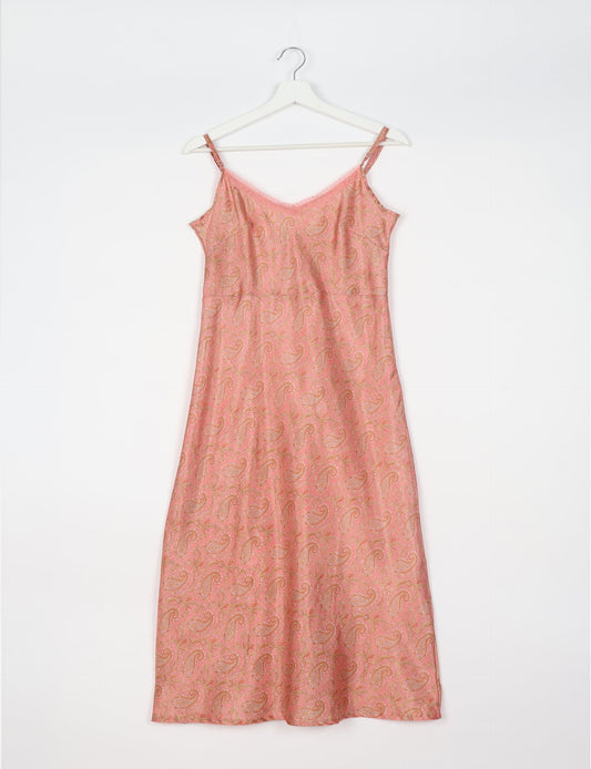Spaghetti strap dress made from sustainable materials, embodying ethical fashion principles. Ideal for eco-friendly travelers seeking laid-back style.
