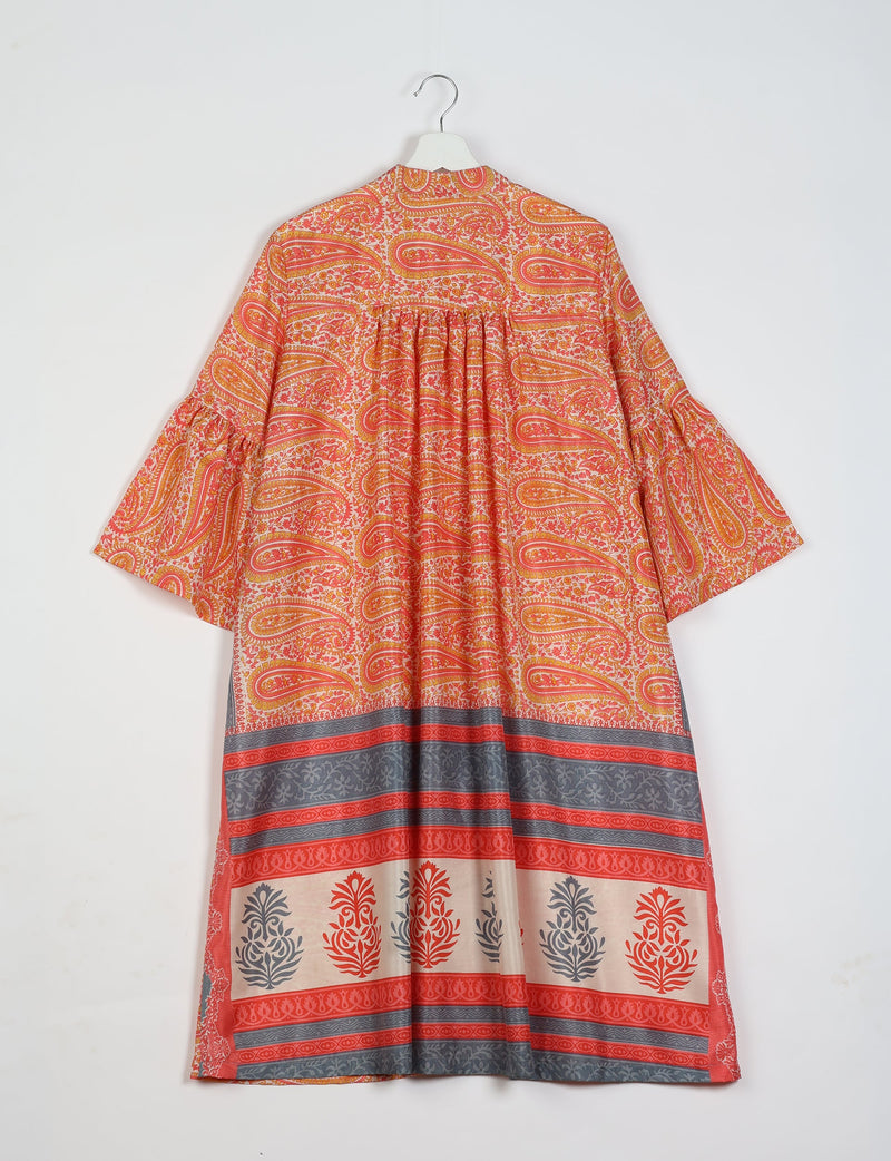 Orange paisley bell sleeve coat with floral and stripe border patterns, shown from back on a white hanger