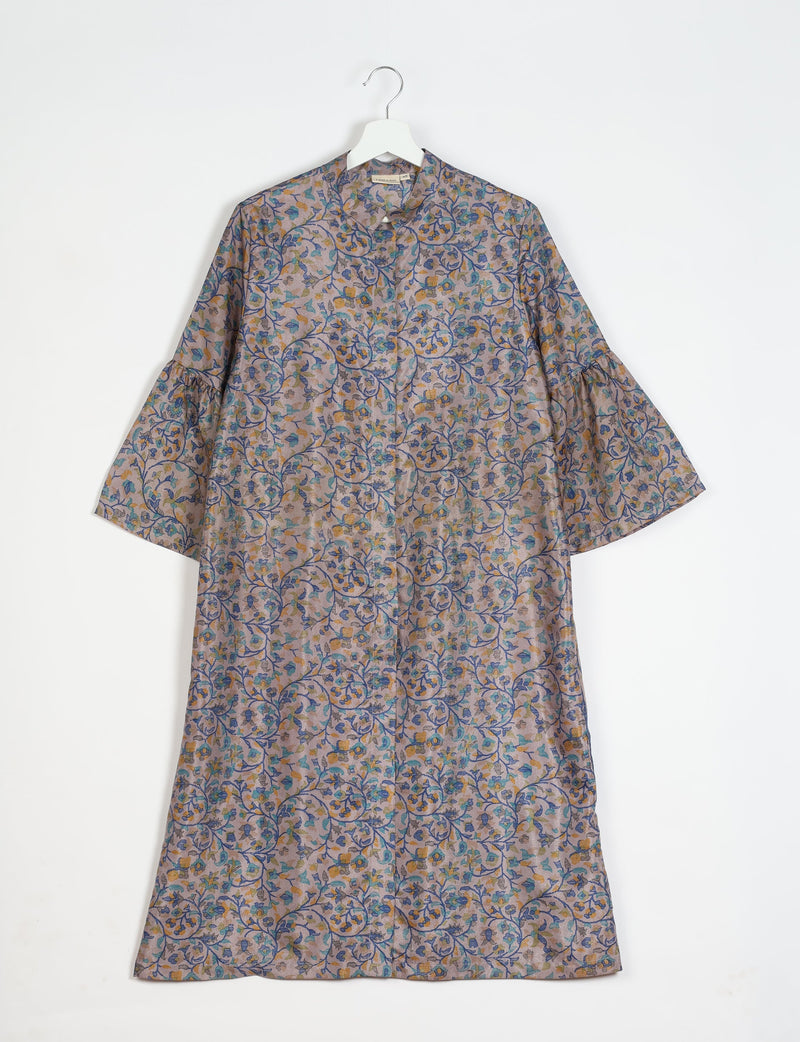Grey bell sleeve coat with blue and yellow floral tropical print, front button closure, hanging on white hanger