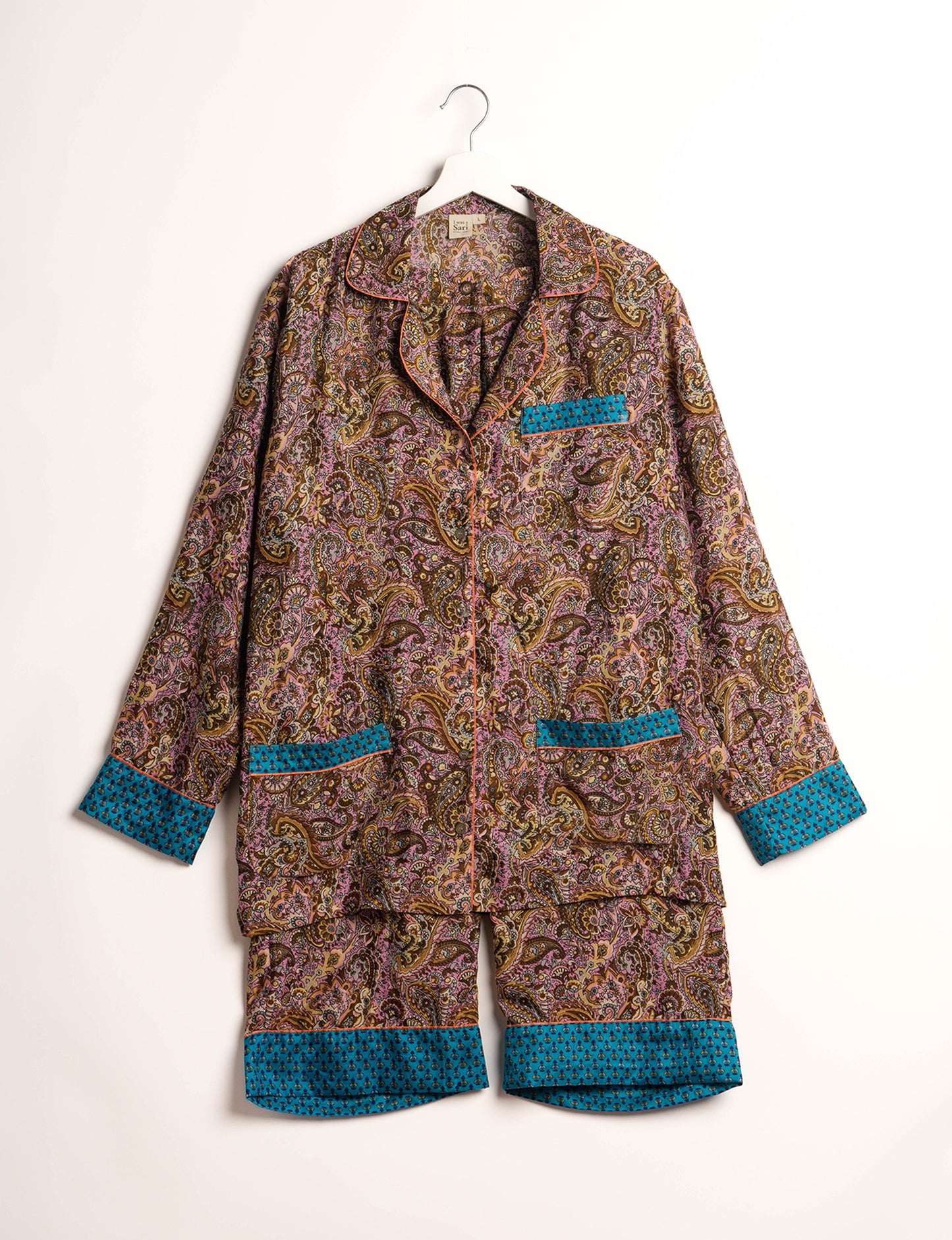 Choose sustainable sleepwear with our PJ SET – perfect for conscious living. From chilling to entertaining, these day-to-night pajamas feature an ethically crafted long-sleeve button-down and elastic-waist pants. Elevate your sleepwear with eco-friendly elegance.