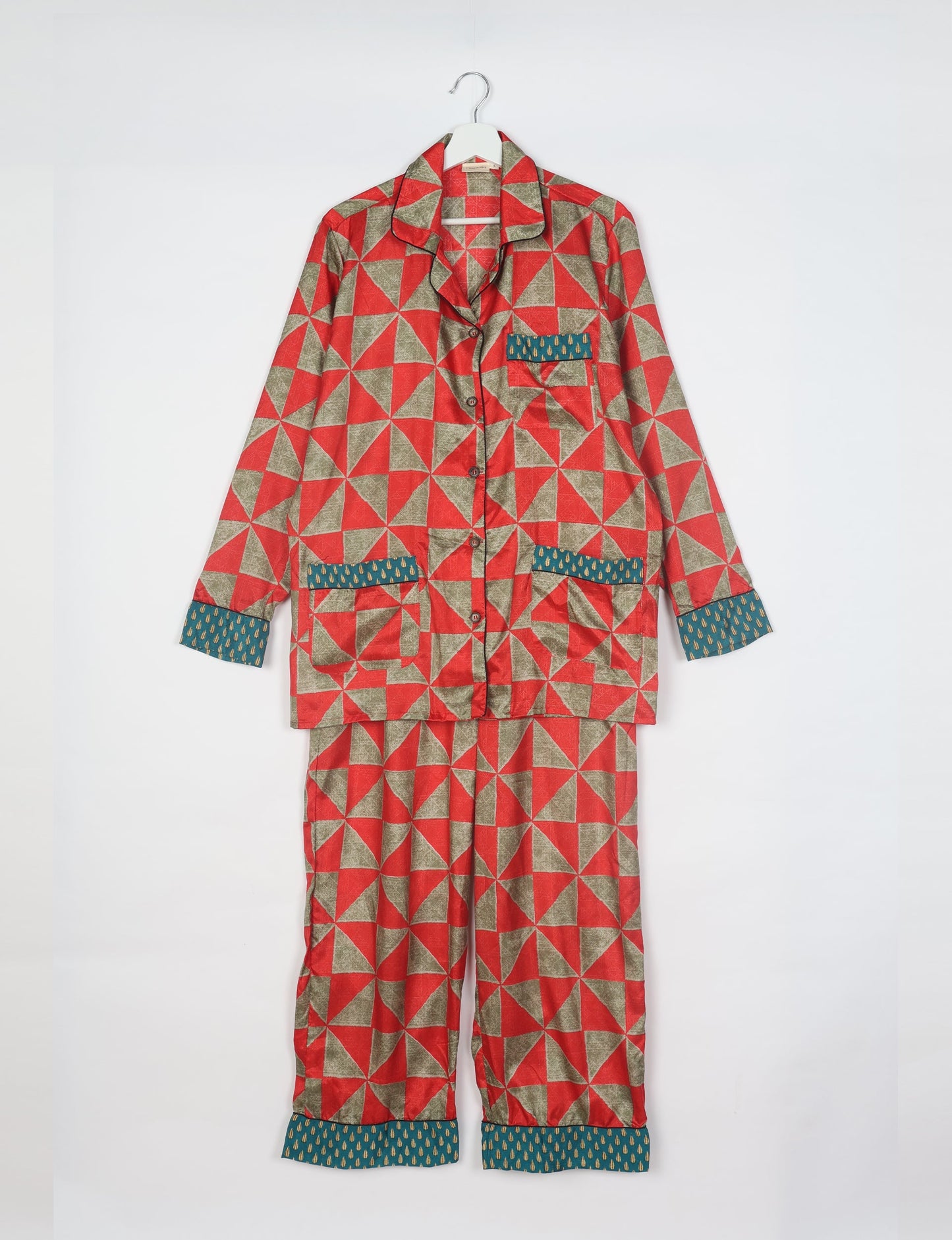 Choose sustainable sleepwear with our PJ SET – perfect for conscious living. From chilling to entertaining, these day-to-night pajamas feature an ethically crafted long-sleeve button-down and elastic-waist pants. Elevate your sleepwear with eco-friendly elegance.