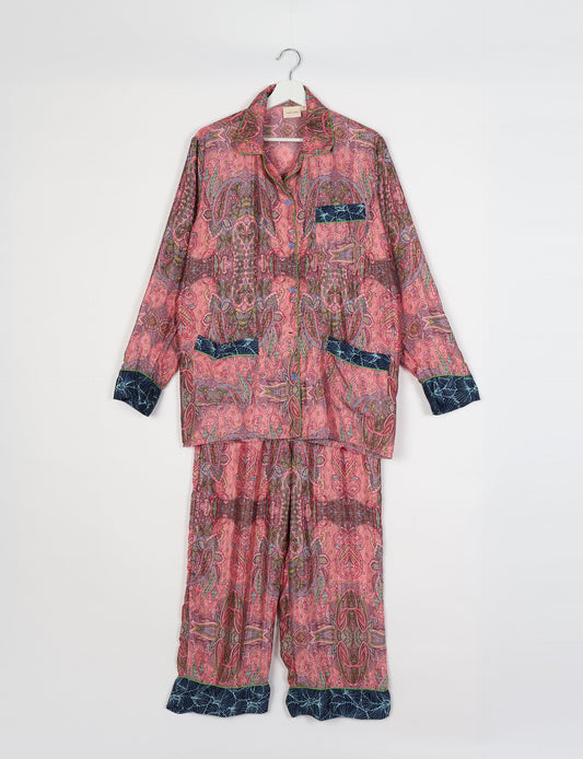 Chic long-sleeve pajama set made from recycled materials, representing eco friendly products, repurposed clothing, and zero waste clothing in green fashion.