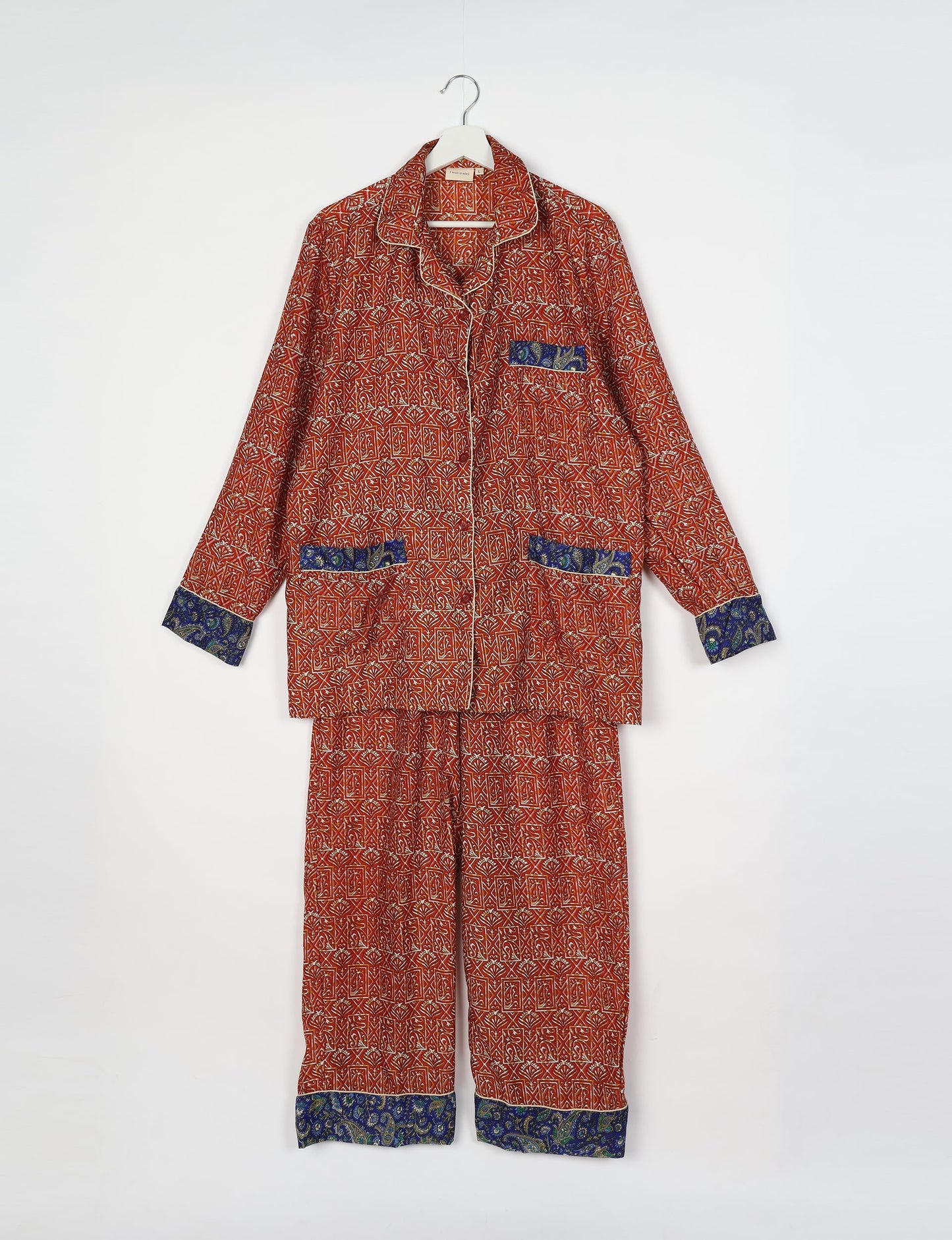 Chic long-sleeve pajama set made from recycled materials, representing eco friendly products, repurposed clothing, and zero waste clothing in green fashion.