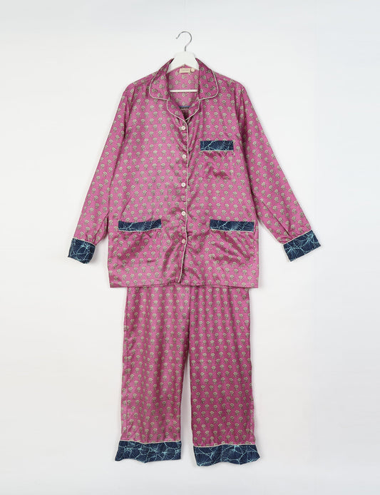 Chic long-sleeve pajama set made from recycled materials, representing eco friendly products, repurposed clothing, and zero waste clothing in green fashion.